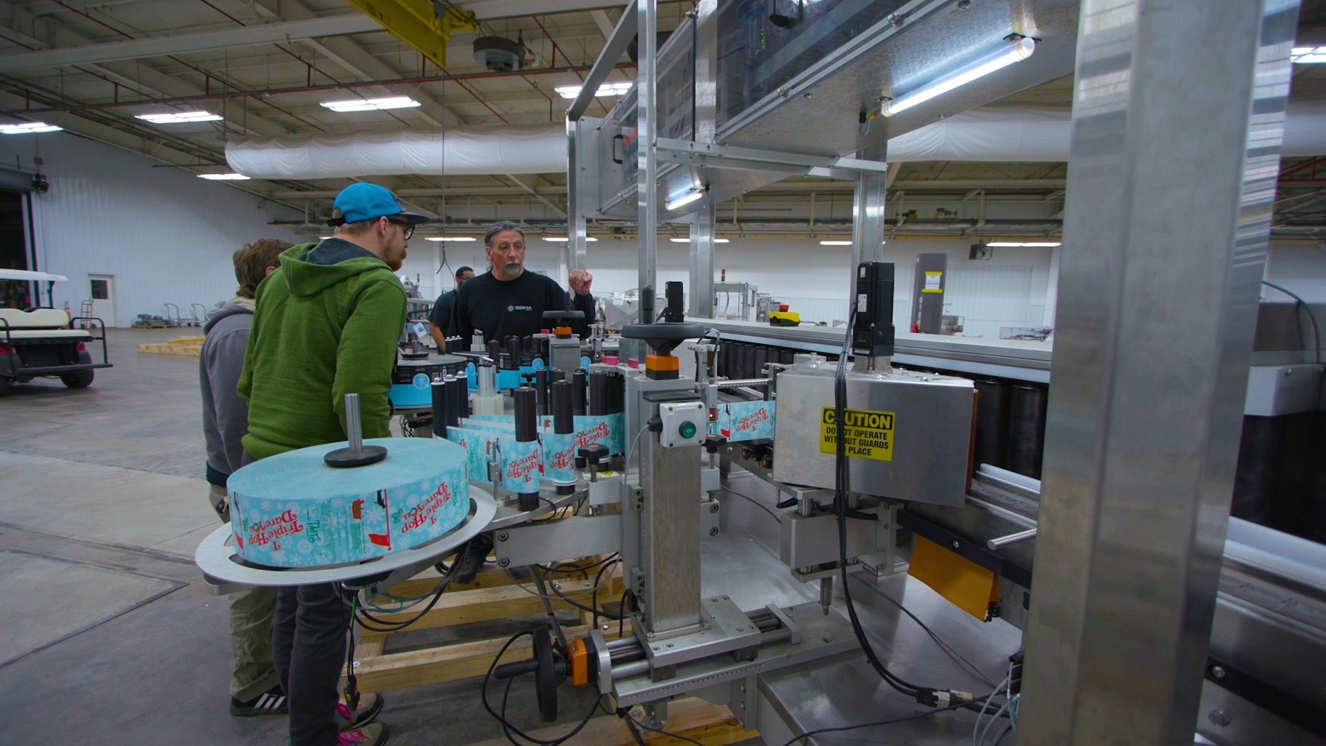 processing line engineers showing manufacturers processing equipment